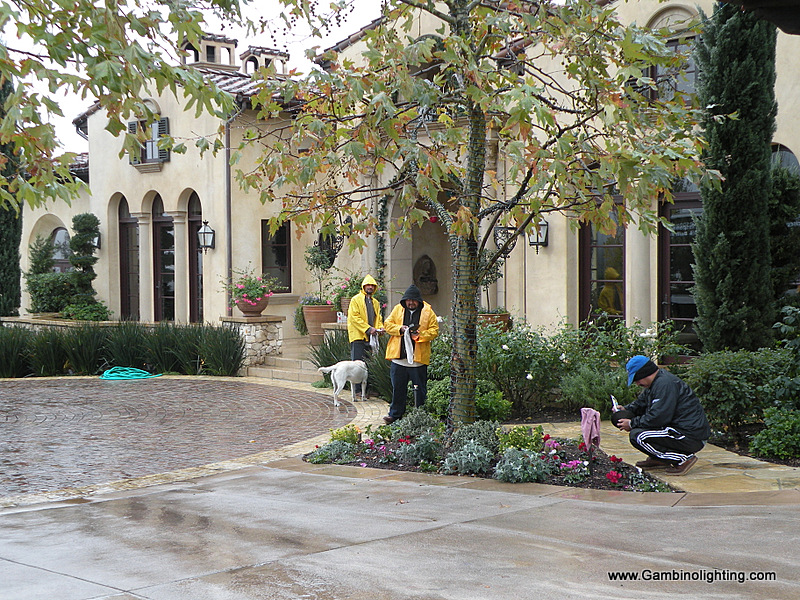 Even rain can't stop Gambino landscape lighting from servicing an important client's system for a Christmas party.